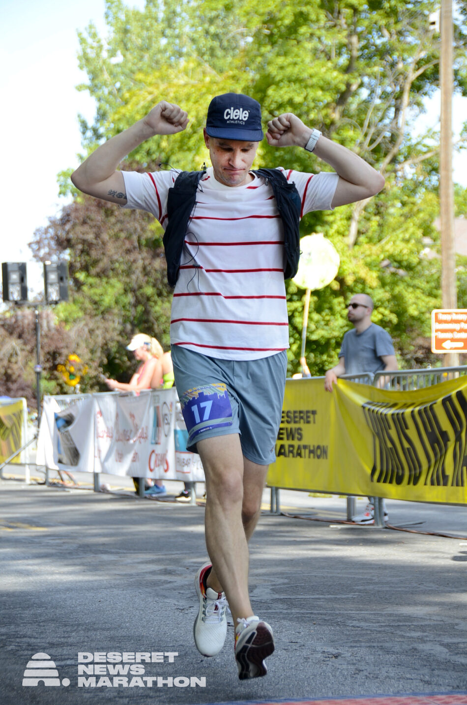 A photo of Devon Akmon crossing the finish line at Liberty Park in downtown Salt Lake City.