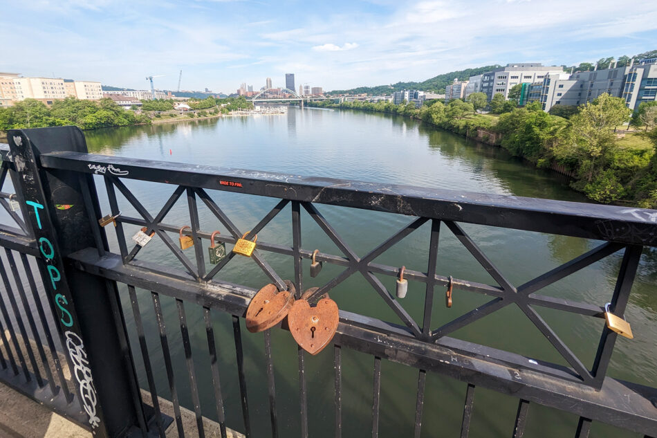 Two love locks on a bridge.
