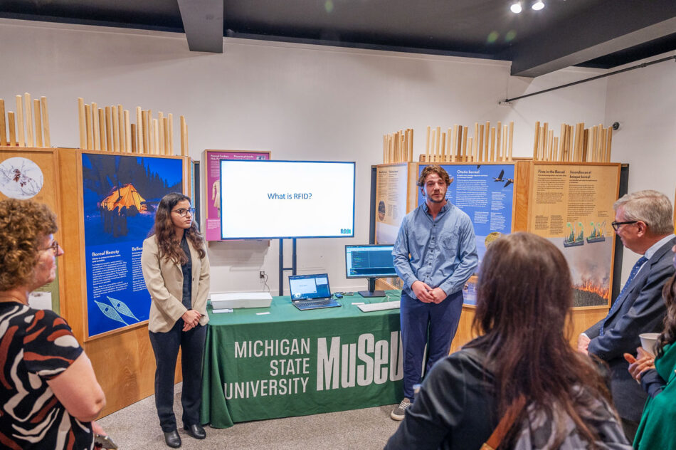 MSU students that led the RFID project speak with MSU Trustees and executive leaders about their work in the exhibition hall.