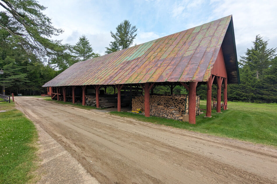 A covered wood barn at Great Camp Sagamore.